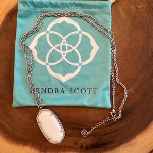 Long Kendra Scott Pendant Necklace silver chain with white stone.